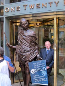 Statue of Gandhi blocking entrance to Goldman Sachs in Boston