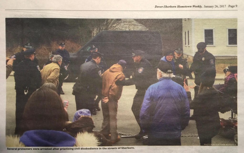 From left to right - Randa, Woods, Holcombe and Gaynor arrested for civil disobedience during Inauguration Day demonstration at the Peace Abbey.